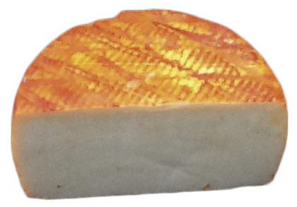 Corte de queso artesano de cabra de pasta blanda con incrustaciones de trufa negra.Cabra Monclús Trufa