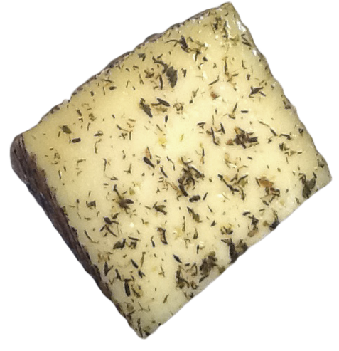 Porción de queso curado de cabra recubierto con finas hierbas aromáticas y especias.